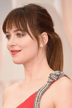 Dakota shone at the Oscars in 2015 in a bold red dress and a simple straight ponytail.: 