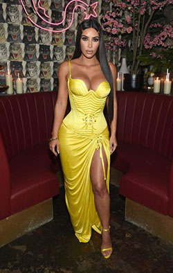 Kim Kardashian in this high-slit yellow corset gown by Versace at the Business of Fashion dinner: Kim Kardashian  