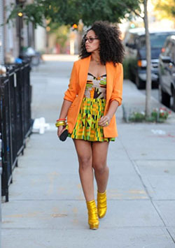 Orange color midis with matching blazer over it are in vague these days among African women.: 