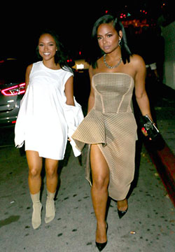 Karrueche stunned in a white, open armed dress and Milian showed off her killer figure in a beige, perforated garment.: 