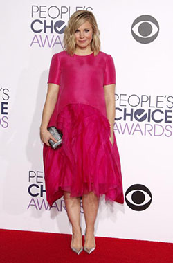 Kristen Bell, who just gave birth to her second child, stepped onto the carpet in this pink, mid length dress. Bell usually nails it, but this seemingly ill fitting ensemble just didn't deliver.: 