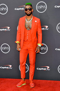 Jaylon Mills in orange tailored 3-piece suit.: 