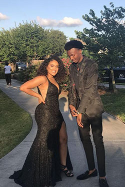 She's all glam in her sparkly black dress, and he matches her shine with his jacket!: Black Couple Homecoming Dresses  