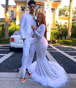 Check out this trendy couple with feathers and sneakers for a homecoming vibe!: Prom Dresses,  Black Couple Homecoming Dresses,  Morning dress,  Prom Suit  