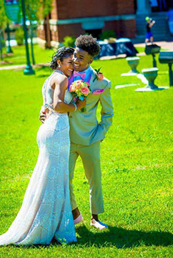 They're all about that homecoming glow, with her dress covered in sequins and his suit a gentle nod to sunny days!: Black Couple Homecoming Dresses,  Prom Suit  