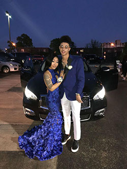 Homecoming in full bloom, her dress a bed of royal blue roses, and his suit clean and crisp!: Backless dress,  Prom outfits,  Black Couple Homecoming Dresses  