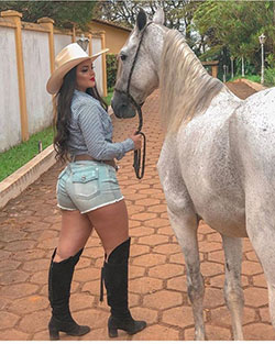 Want to make heads turn at the ranch? Slip into some light blue shorts and sleek black boots!: Cowgirl Outfits,  Animal print,  Cowboy hat  