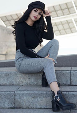 To create the perfect ensemble for a party, wear a black sweater with gray pants. You just need to add a pair of black ankle boots.: 