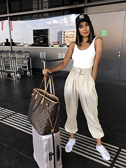 White colour outfit with fashion accessory, sportswear, trousers: Fashion photography,  White Outfit,  Fashion accessory,  Street Style,  Airport Outfit Ideas,  Pleated Trousers  