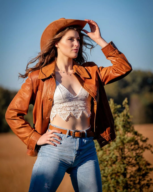 Hot Cowgirl Outfit For Ladies With Brown Leather Jacket, White Bralette and Blue Jeans: Cowgirl Outfits,  Cowgirl Fashion,  Country Outfits,  cowgirl hat,  Bralette Outfits,  Bralette Top  