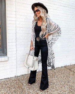 cute and chic outfit with black flare jeans, luggage and bags, street fashion: 