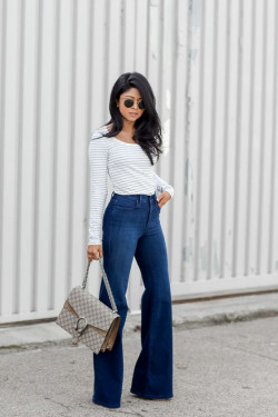 Cute girl outfit with white long sleeve top and flare jeans outfit: 