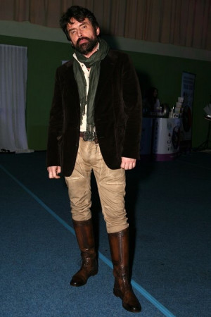 Man wearing tall boots knee-high boot, riding boot, cowboy boot: 