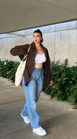 She's just keeping things chill and comfy in her light wash jeans and white crop top!: Jeans,  Wide-Leg Jeans,  Mom jeans  