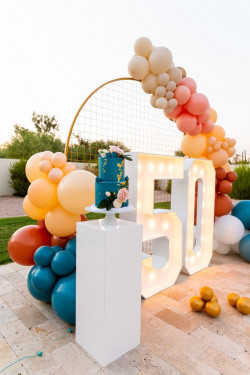 Here’s to bright beginnings at fifty with a vivid array of balloons: 
