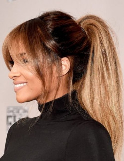 You've gotta try rocking that ponytail with flair, adding curtain bangs and a hint of auburn!: 