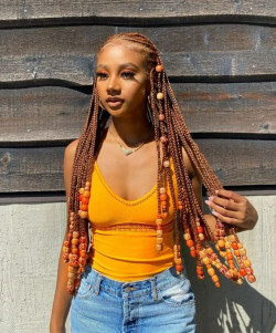 As fall rolls in, picture those braids transforming into a cozy mix of earthy tones with natural beads: 