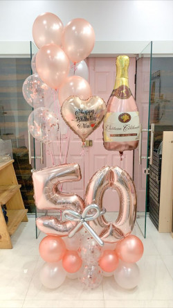 Got this pink champagne balloon bouquet that's sparkling up the 50th celebration. It's so cute and sparkly, you'd think it's fizzing: 