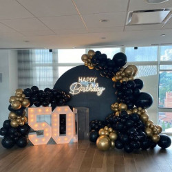 Half a century never looked so good! Celebrating with these glossy balloons and dazzling lights. Seriously, it's amazing!: 