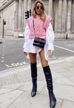 And how about going all out in pink? Pairing that sweater vest with a white dress and boots makes for such a fun and adventurous outfit: 