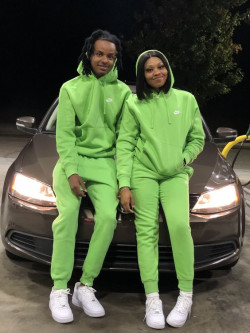 Get ready to shine with these matching outfits that bring the neon glow. You'll definitely be the brightest duo around!: Couple costume,  Motor vehicle,  Air Jordan,  Lapel pin  