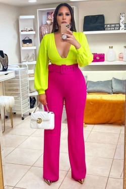 Oh, she's looking amazing in that neon top and pink pants!: 