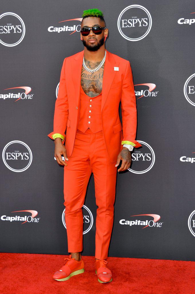 Jaylon Mills in orange tailored 3-piece suit.: 