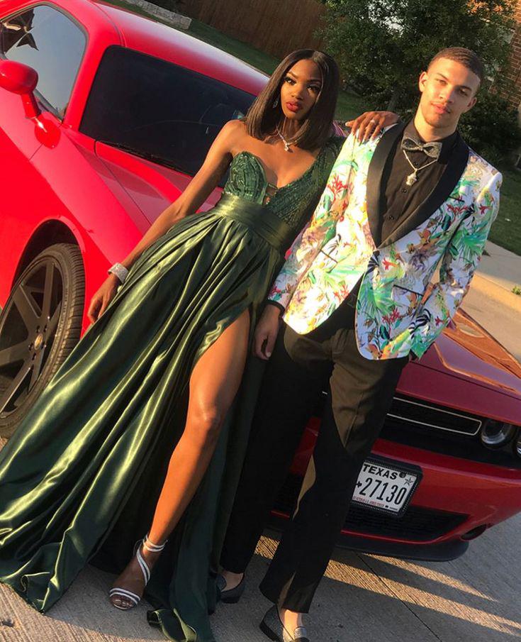 Step into the limelight with her emerald green gown and his statement floral blazer!: party outfits,  Black Couple Homecoming Dresses  