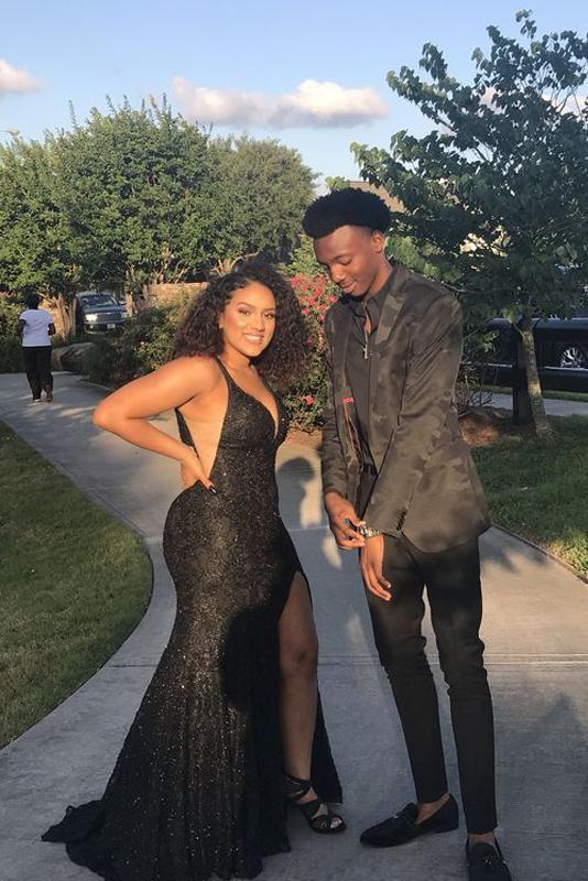 She's all glam in her sparkly black dress, and he matches her shine with his jacket!: Black Couple Homecoming Dresses  
