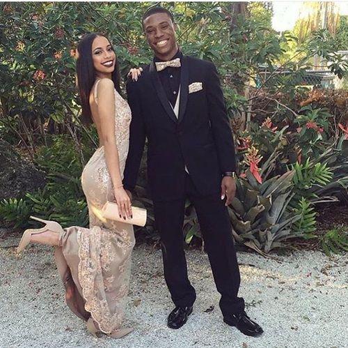 Can you see her? She's like a vision in that soft lace dress, and him? He's looking all smooth in his suit!: party outfits,  Backless dress,  Prom couples,  Black Couple Homecoming Dresses  