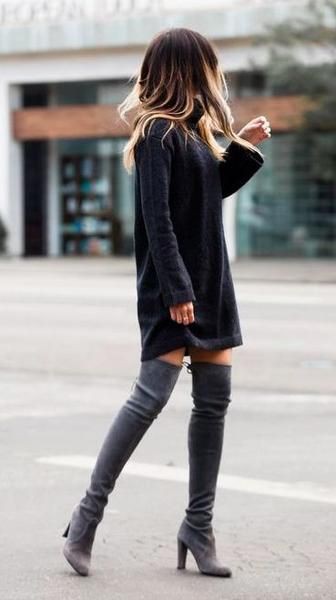 Oversized sweater dress with thigh high boots on Stylevore