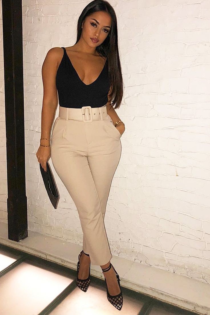 Beige belted tapered trousers on Stylevore