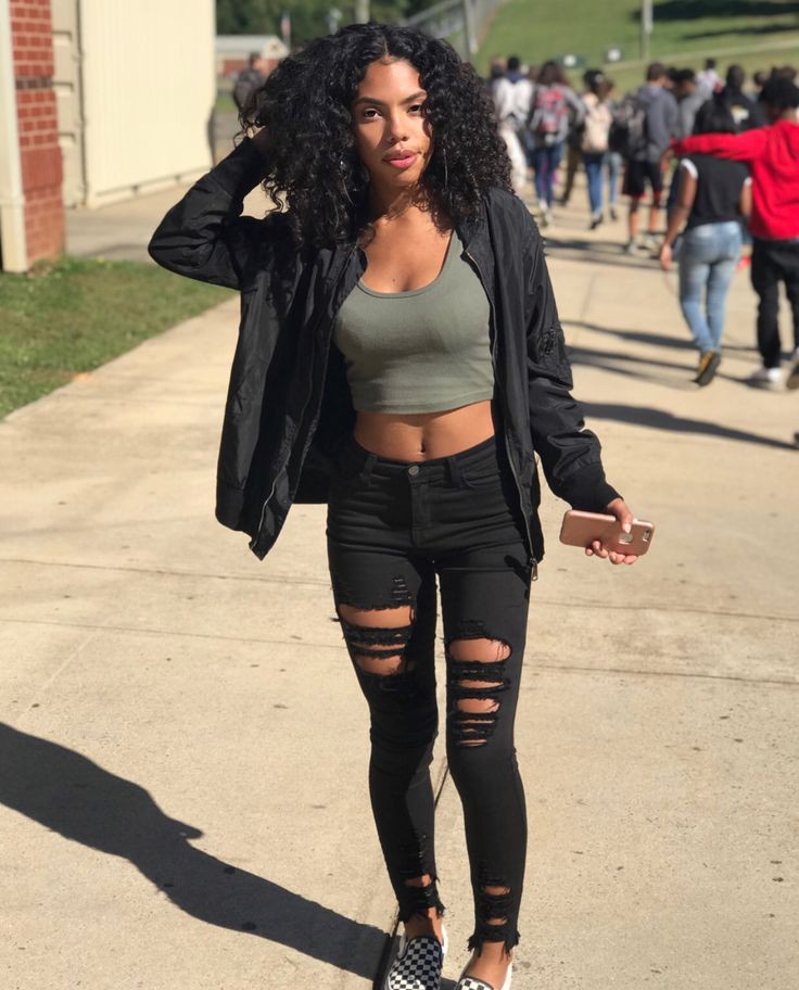 She’s bringing the bold to school with black distressed jeans and a crop top!: Baddie Outfits  