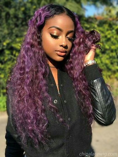 Dark purple curly hair on Stylevore