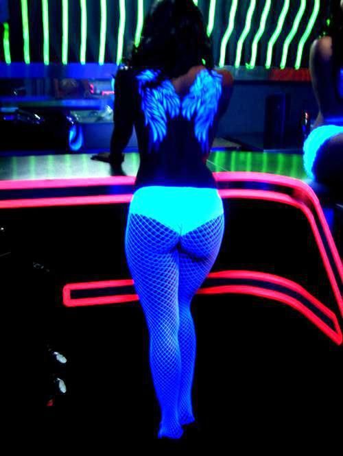 Hot girl in glow in the dark fishnet outfit