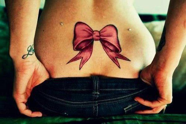 Lower back bow tattoo, Lower-back tattoo: Tattoo artist,  Tattoo Ideas  