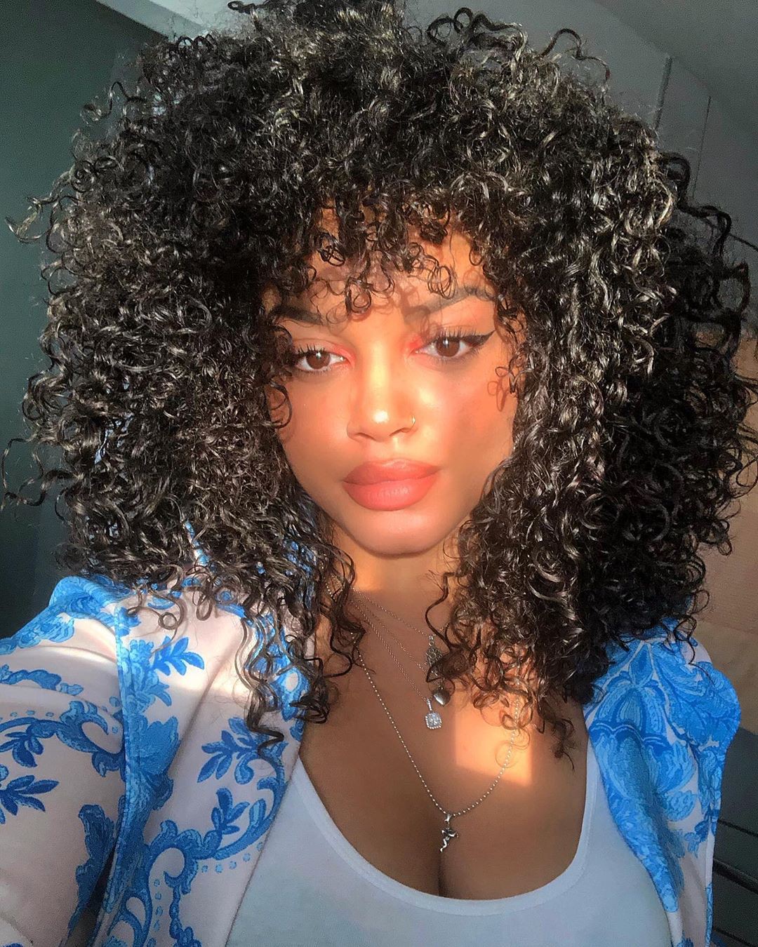 Sina Iuna Natural Black Hairstyles, Haircuts, cute Haircuts: Jheri Curl,  Black hair,  Jeans Outfit,  Turquoise Undergarment  