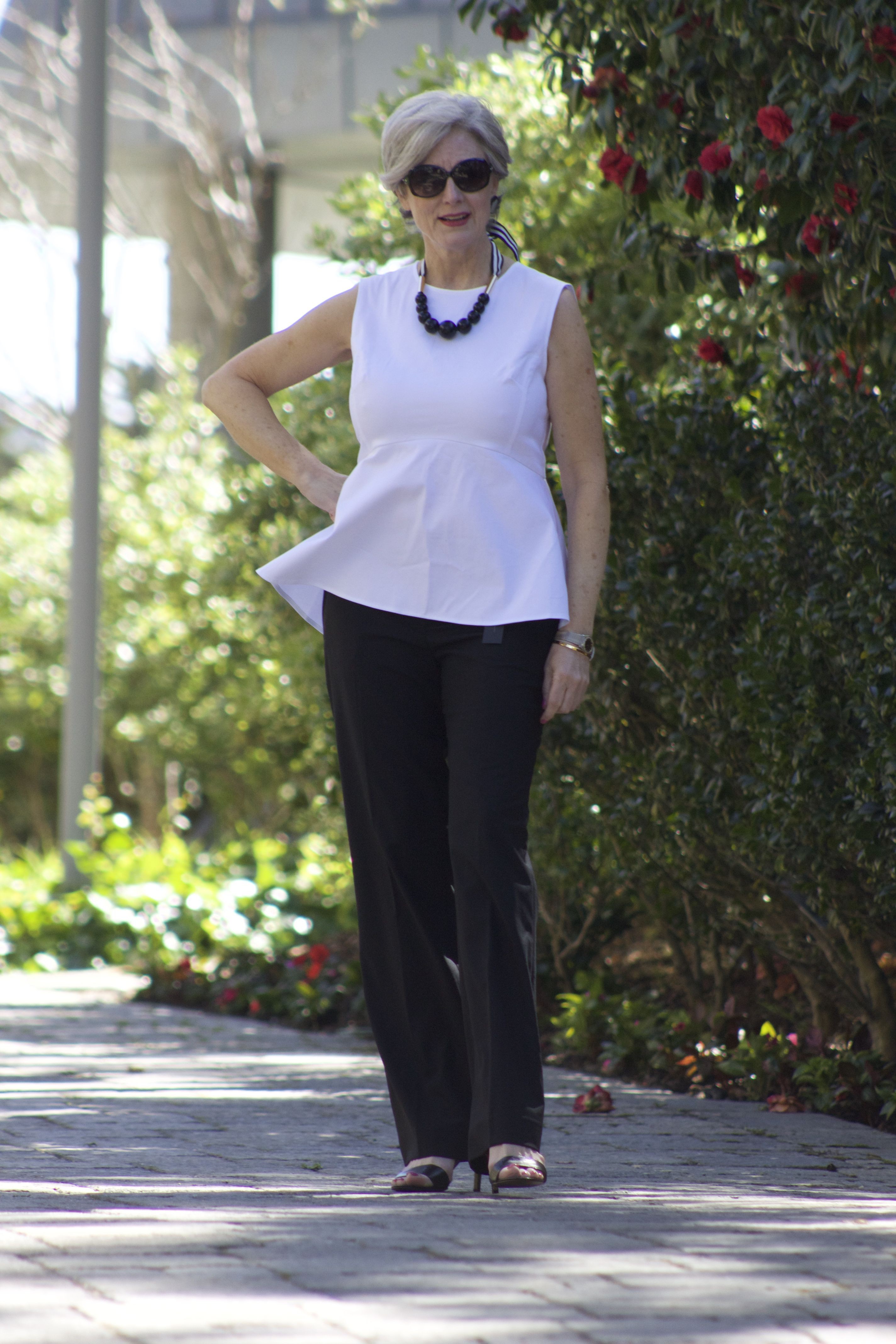 White dresses ideas with trousers, jeans | Peplum Top With Pants: Fashion photography,  Lapel pin,  White Outfit,  Street Style,  Knee High Boot,  Peplum Tops  