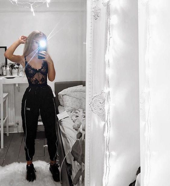 Girl in mirror in joggers: White Outfit,  Lace Bodysuit  