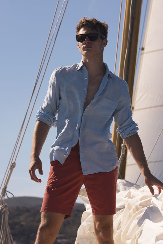 Light Blue Shirt, Boating Wardrobe Ideas With Orange Casual Short, Sunglasses: 