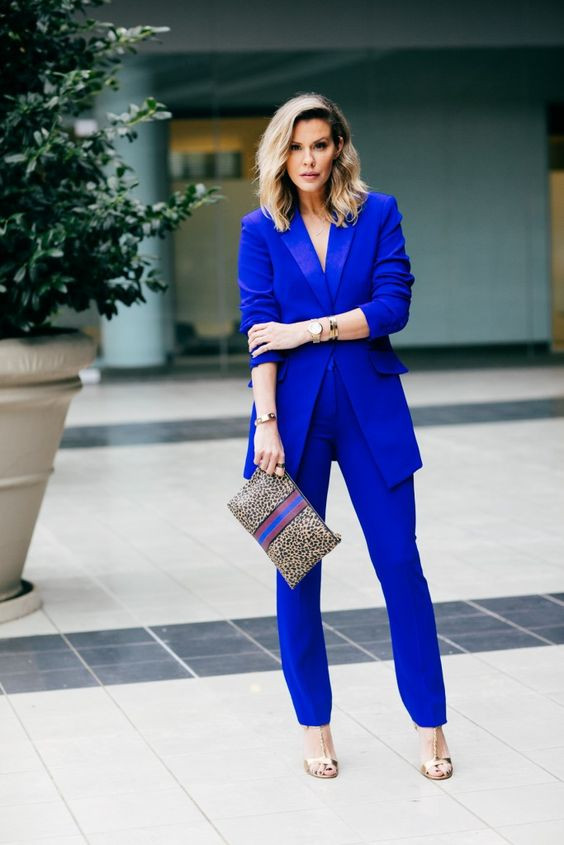 Royal blue pants outfit luggage and bags
