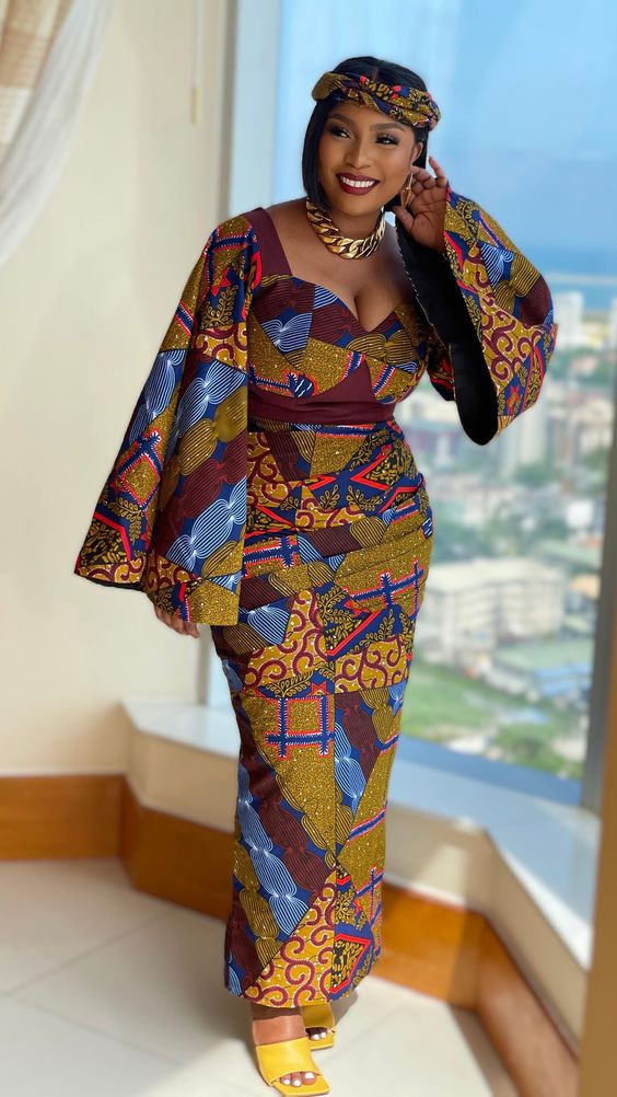 Explore the Fusion of Elegance and Tradition in This Finely Crafted Geometric Gown Made from Ankara Fabric: 
