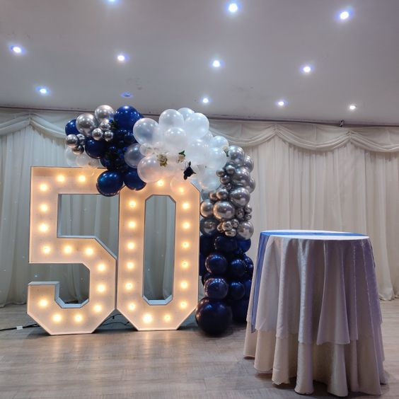 I can already imagine the electric blue elegance lighting up the party for a sparkling 50th bash!: balloon,  balloon arch garland kit,  event designing by ella,  baby shower decoration,  party decoration,  Interior Design,  Flower Bouquet,  party any time,  Electric blue,  function hall,  party supply  