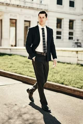 The graduate's go-to? A tailored black suit that combines style with comfort