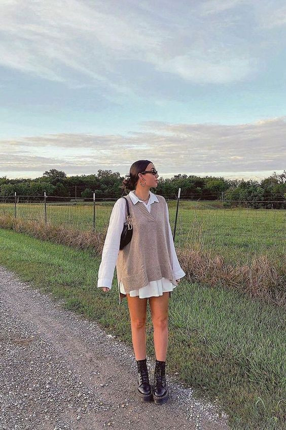 A cozy sweater vest paired with a breezy white dress!: girl,  Nasty Gal,  tank top  