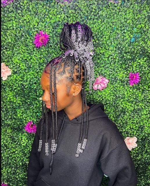 Digging those purple passion knotless braids, especially with a touch of silver beads adding some sparkle: flower,  facial expression,  Black hair  