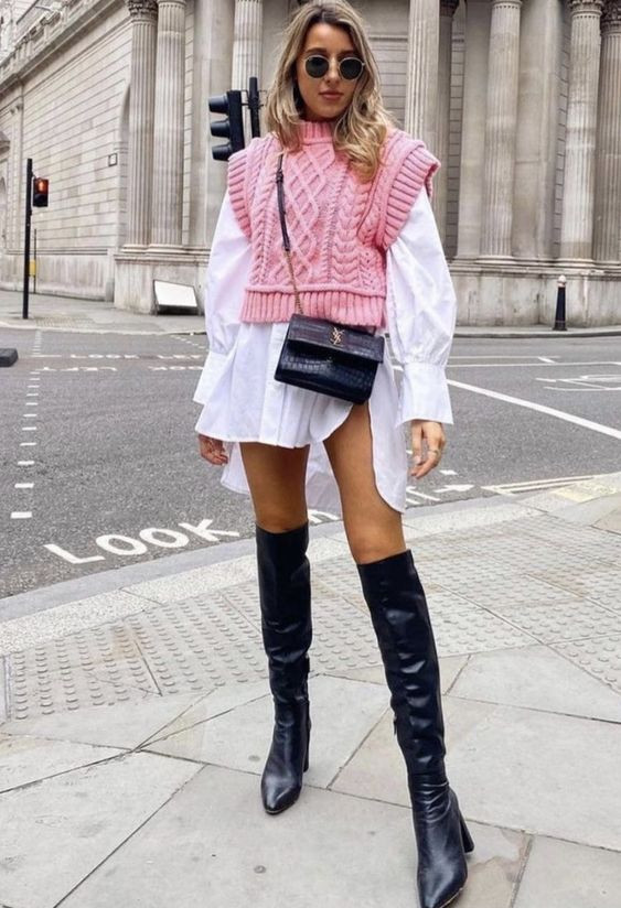 And how about going all out in pink? Pairing that sweater vest with a white dress and boots makes for such a fun and adventurous outfit: 