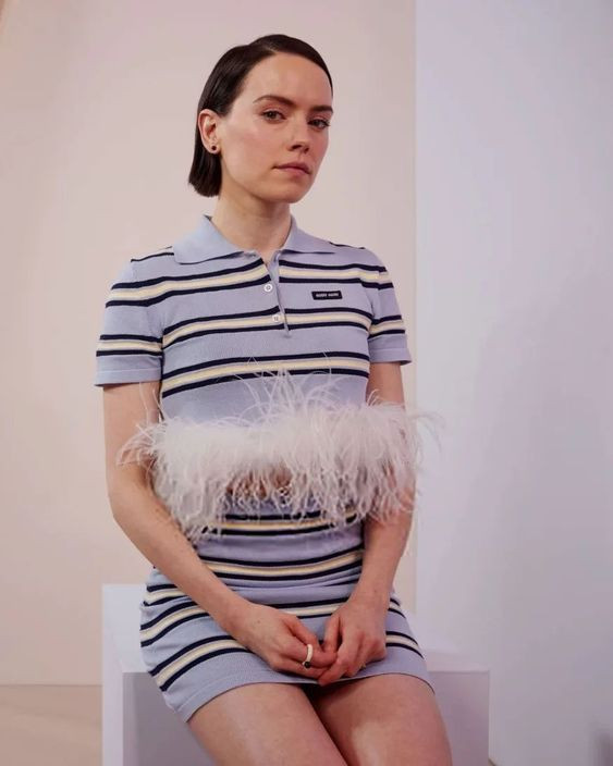 Oh wow, have you seen her in that feather-trim flirt? Her striped outfit is seriously sexy and chic!: mother,  Portrait photography,  south by southwest,  daisy ridley  