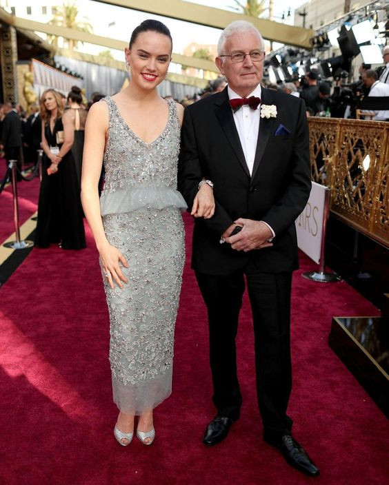 She's like a silver screen siren in that sexy dress, totally mirroring the star-studded event!: daisy ridley dad,  star wars sequel trilogy,  chris ridley,  daisy ridley,  Nina Dobrev,  red carpet  