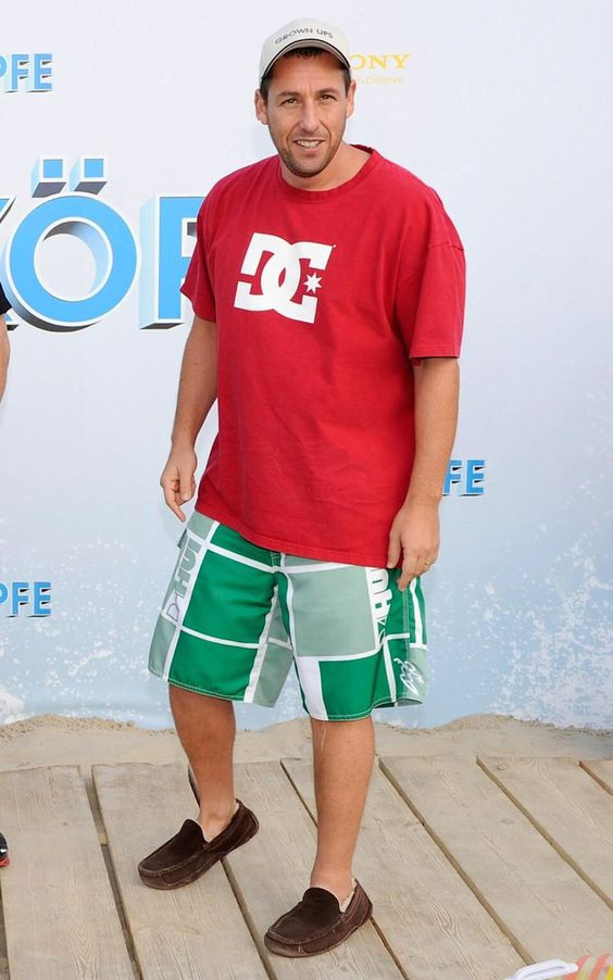 Summer's here and Adam's sporting his red tee and green shorts combo🌞: adam sandler fits,  1999 kids' choice awards,  fashion sensation,  Bermuda shorts,  adam sandler,  Board Short  